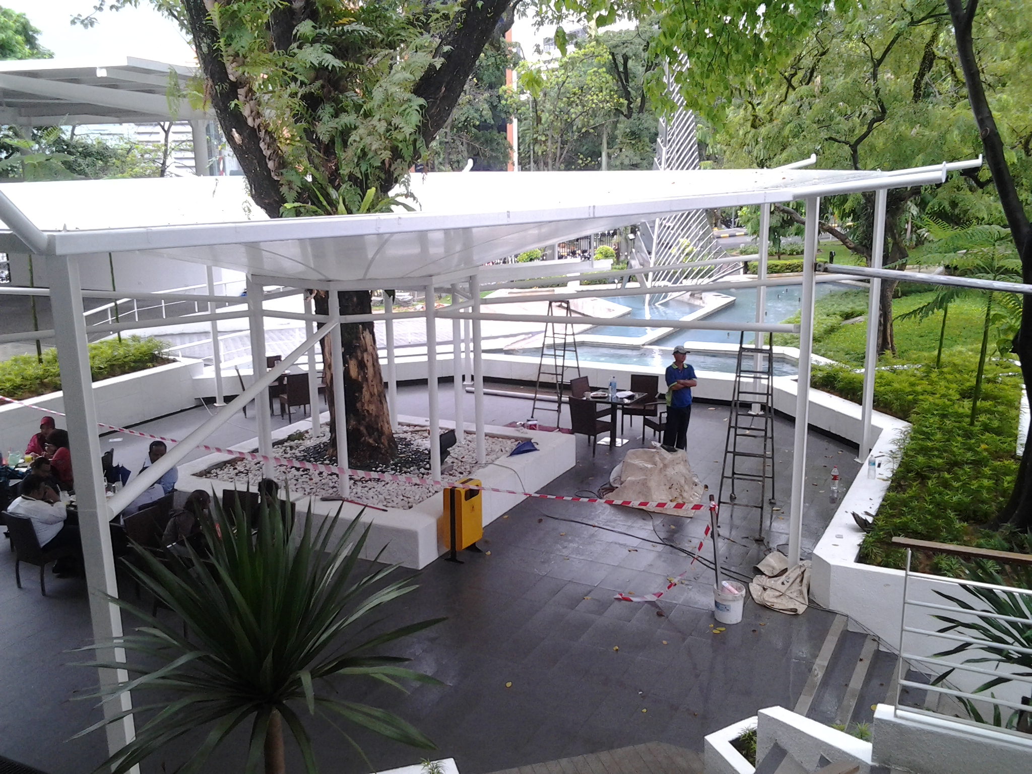 Tensile fabric structures creating an inviting atmosphere at Laman Menara Maybank food court, Kuala Lumpur